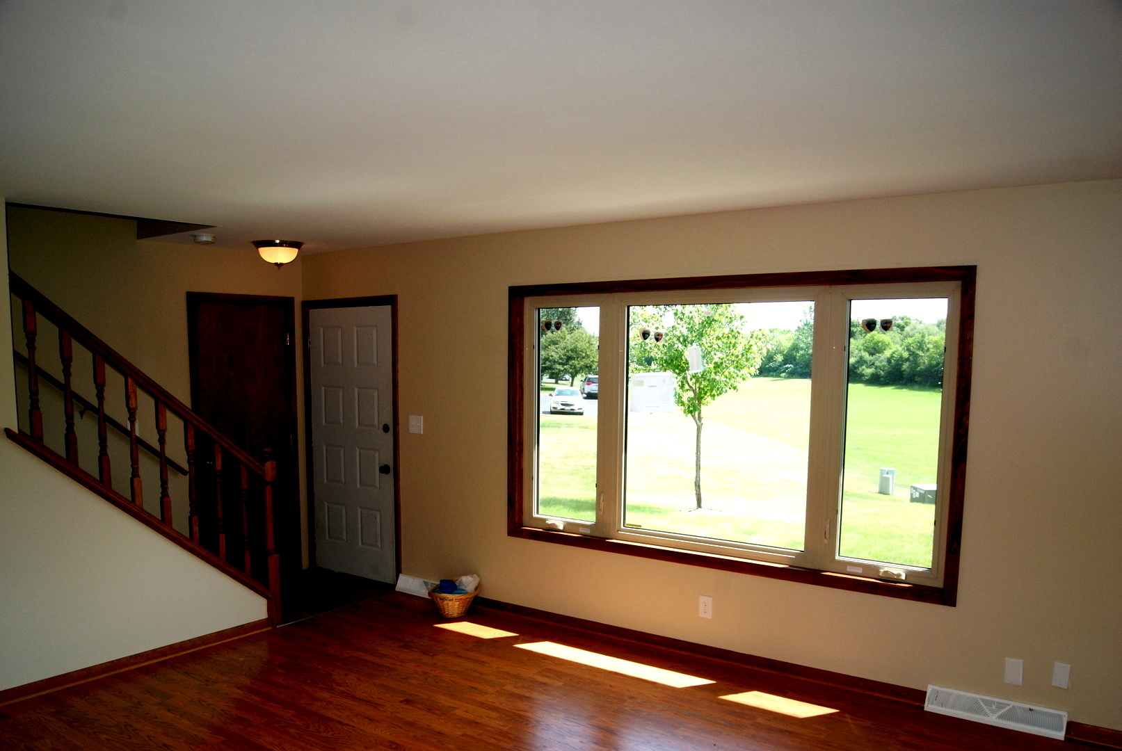 264 Circlegate Road New Lenox, IL 60451 - Photo 12 of 28 a view of an empty room with wooden floor and a window