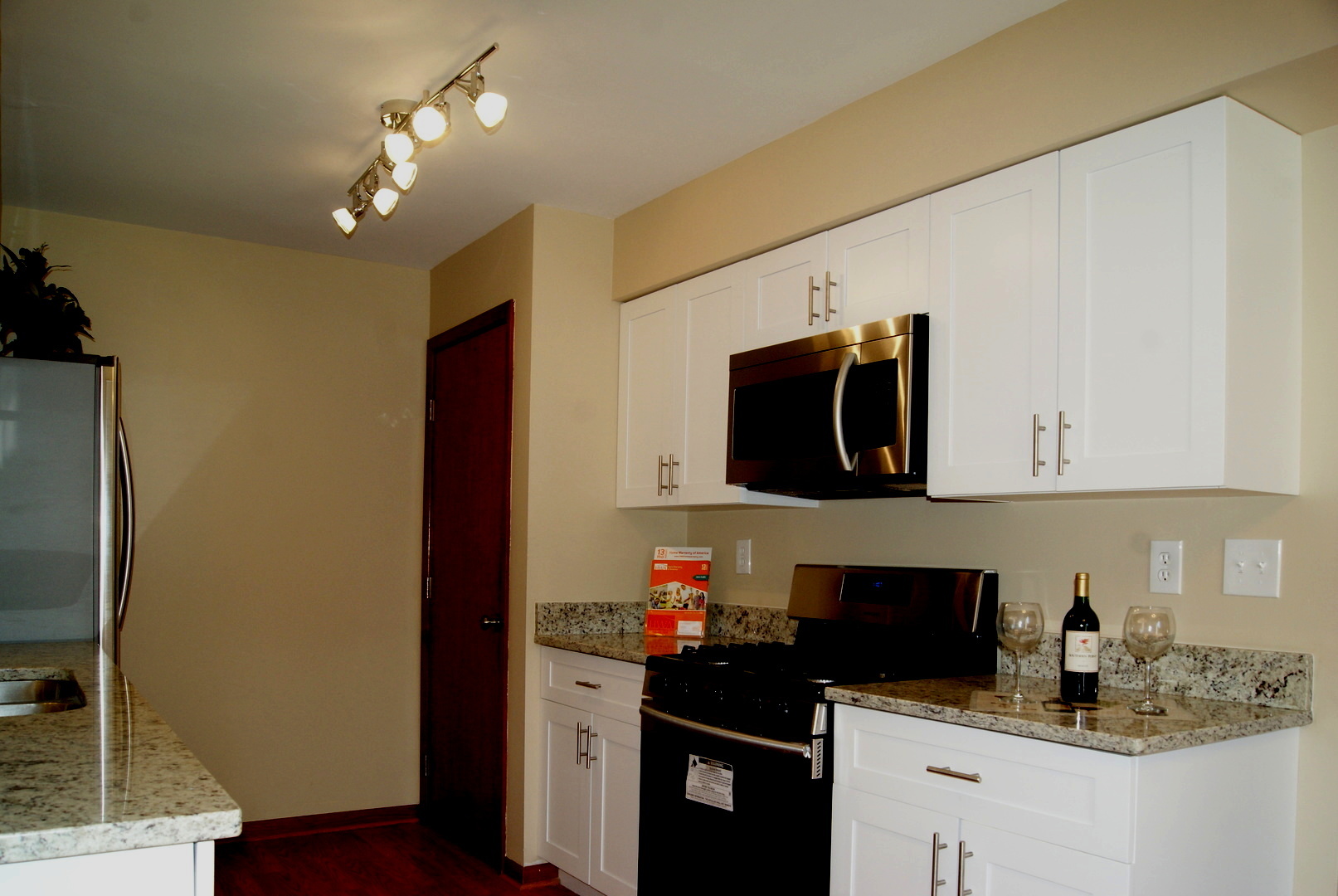 264 Circlegate Road New Lenox, IL 60451 - Photo 6 of 28 a kitchen with stainless steel appliances granite countertop a refrigerator and a stove top oven
