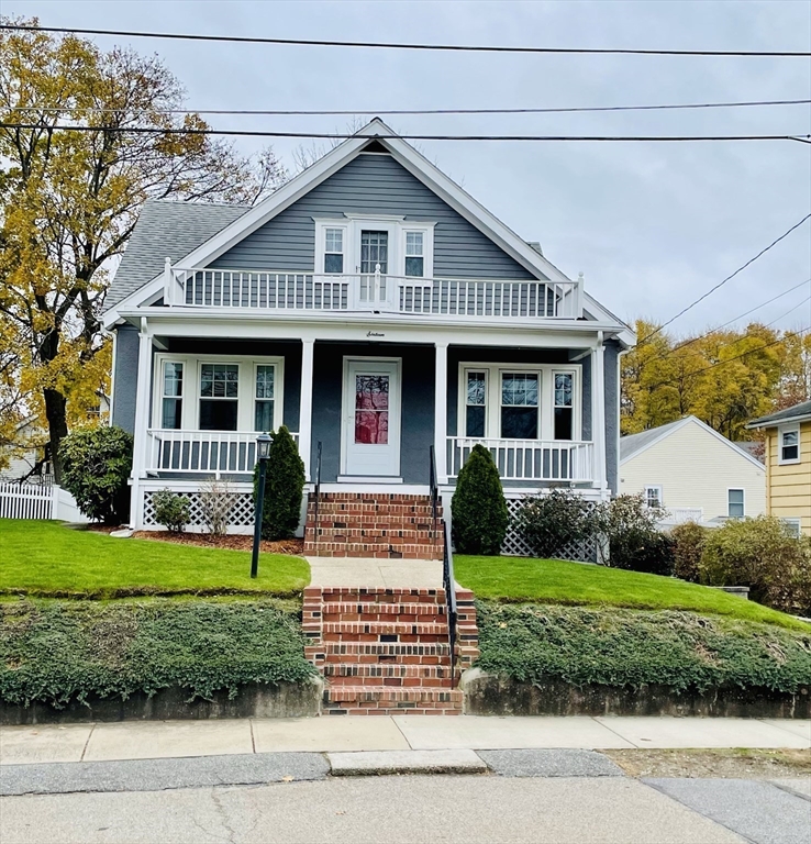 16 York Avenue Watertown, MA 02472 - Photo 1 of 34 a front view of a house with a yard and garage