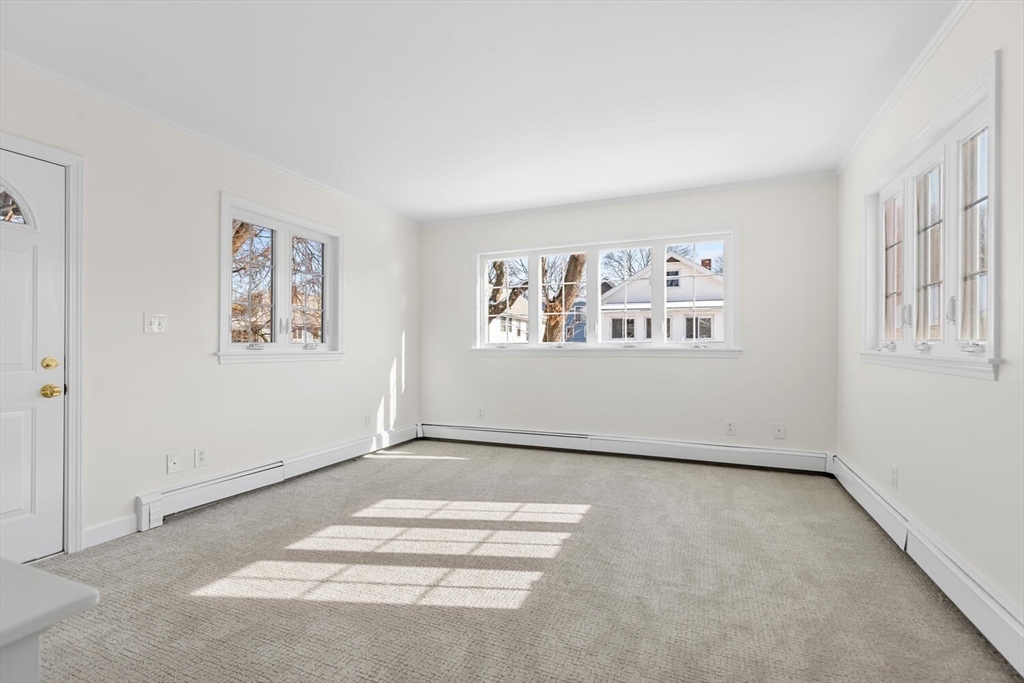 16 York Avenue Watertown, MA 02472 - Photo 14 of 34 a view of a big room with windows and cabinet