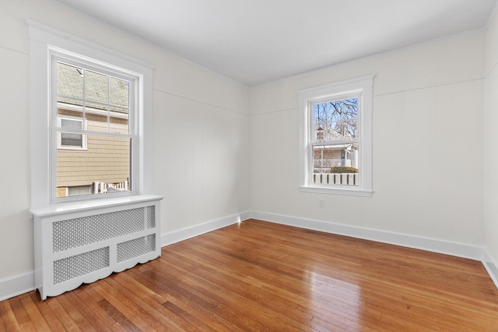 16 York Avenue Watertown, MA 02472 - Photo 17 of 34 a view of a kitchen with wooden floor and a window