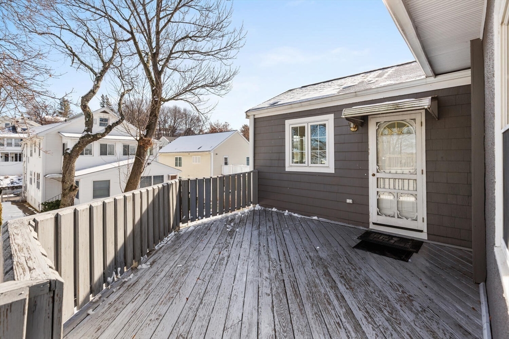 16 York Avenue Watertown, MA 02472 - Photo 30 of 34 a view of backyard with deck and wooden floor
