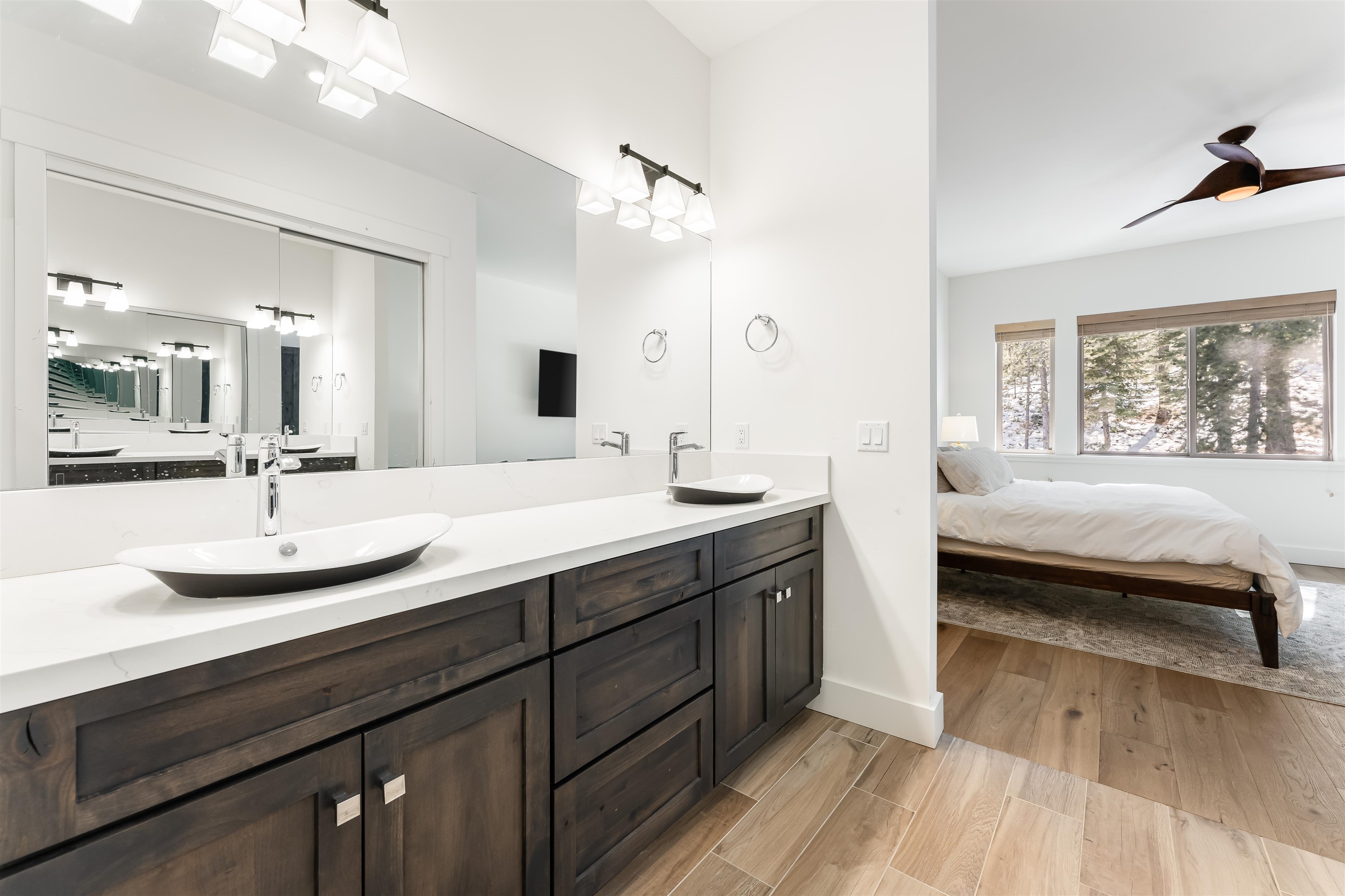 11643 McClintock Loop, Unit 4 Truckee, CA 96161 - Photo 3 of 8 a en suite bathroom with a double vanity sink and a mirror