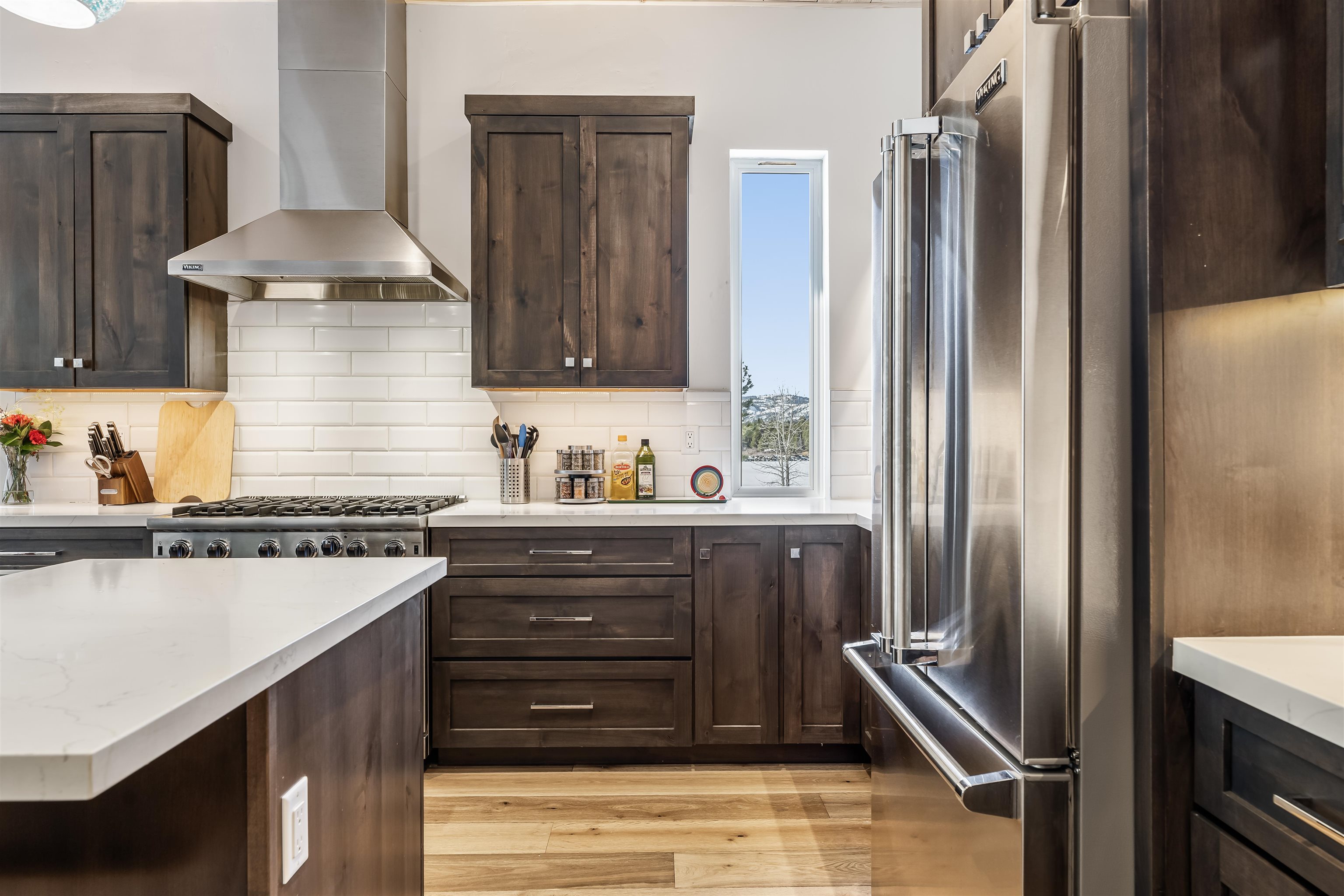 11643 McClintock Loop, Unit 4 Truckee, CA 96161 - Photo 6 of 8 a kitchen with stainless steel appliances granite countertop a refrigerator and a stove
