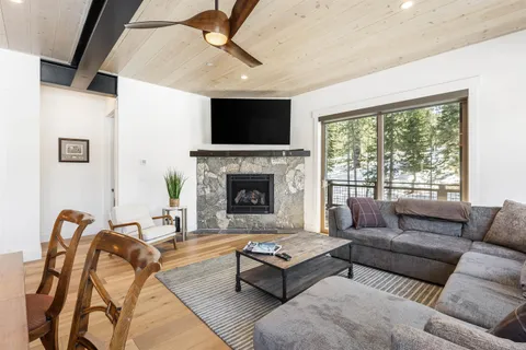 a living room with furniture fireplace and a flat screen tv