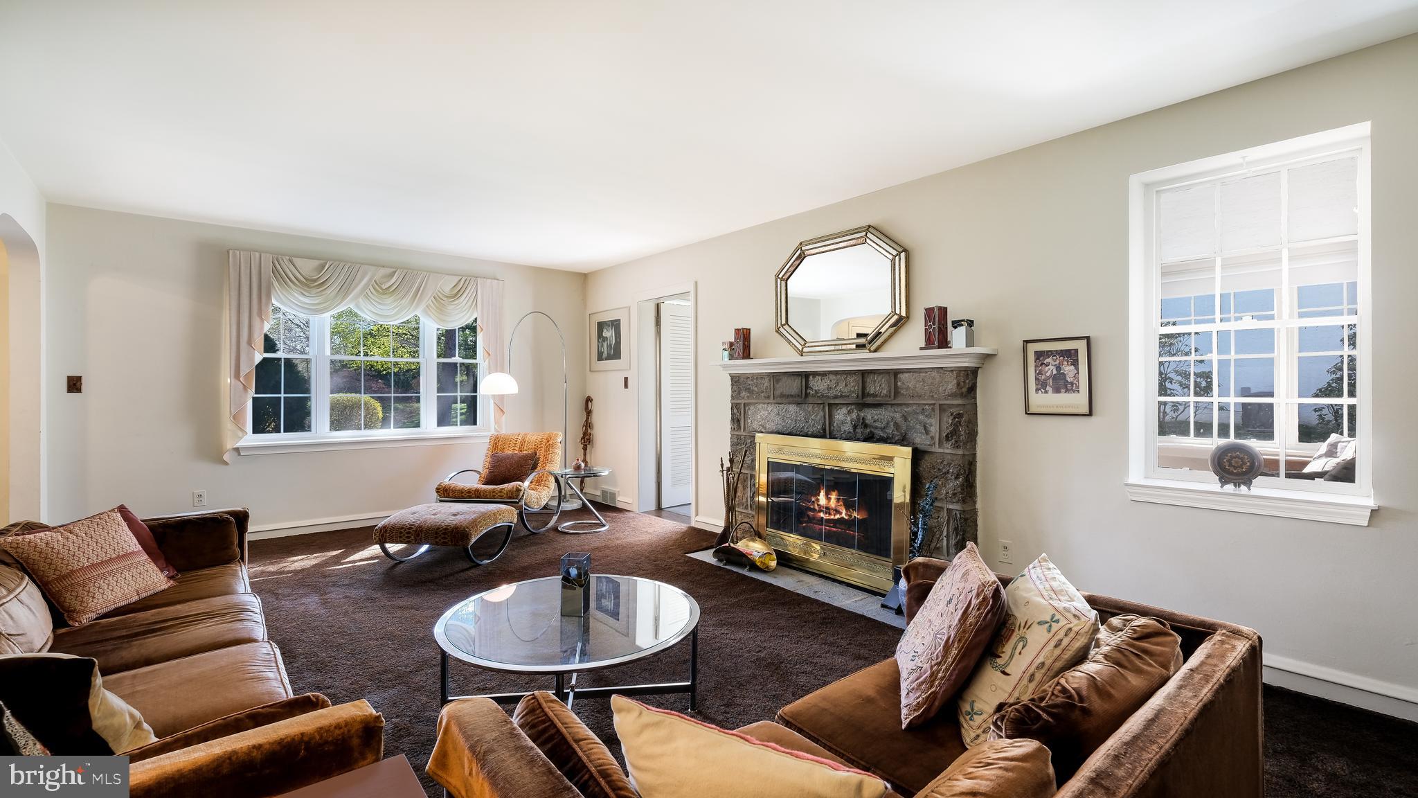 792 Dale Road Jenkintown, PA 19006 - Photo 6 of 27 a living room with furniture a window and a fireplace