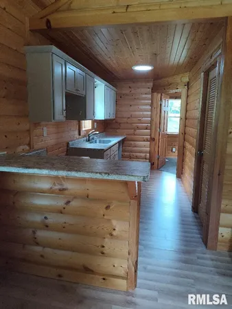 a view of room with wooden floor
