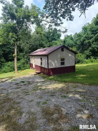 a house with trees in the background