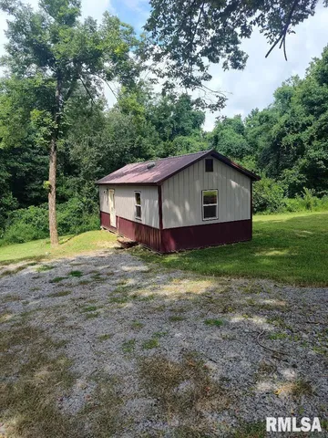 a house with trees in the background
