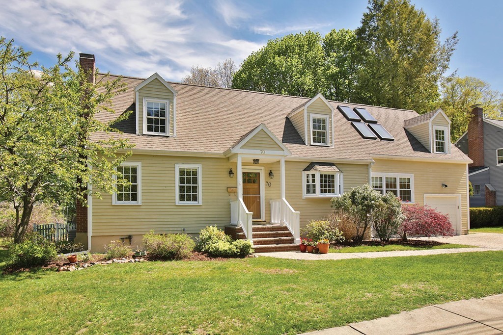 70 Longfellow Road Newton, MA 02462 - Photo 1 of 7 a front view of a house with a garden