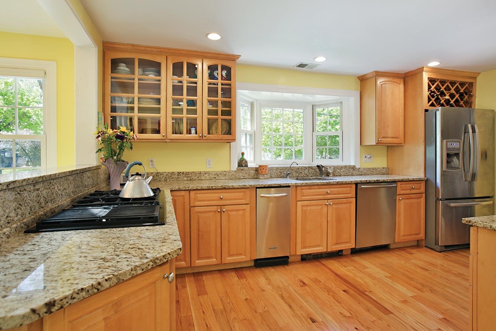 70 Longfellow Road Newton, MA 02462 - Photo 4 of 7 a kitchen with stainless steel appliances granite countertop a stove a sink and a refrigerator