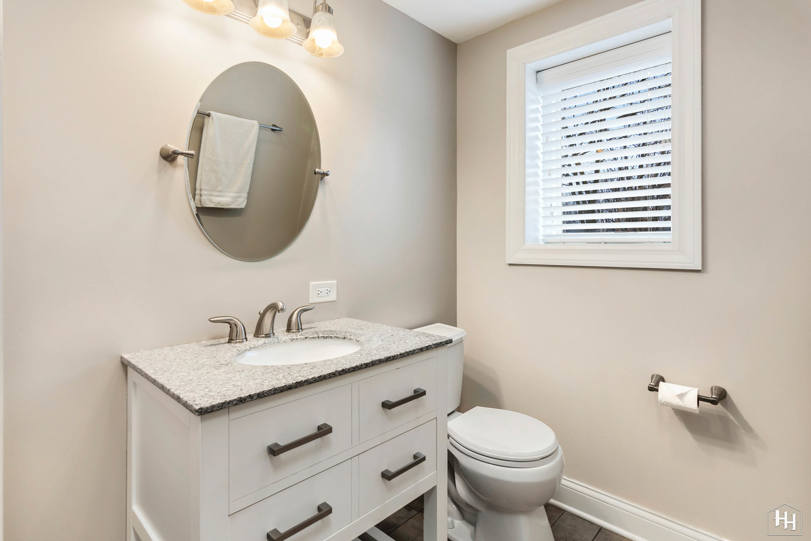 7N298 Longridge Road St. Charles, IL 60175 - Photo 16 of 38 a bathroom with a granite countertop toilet a sink and a mirror