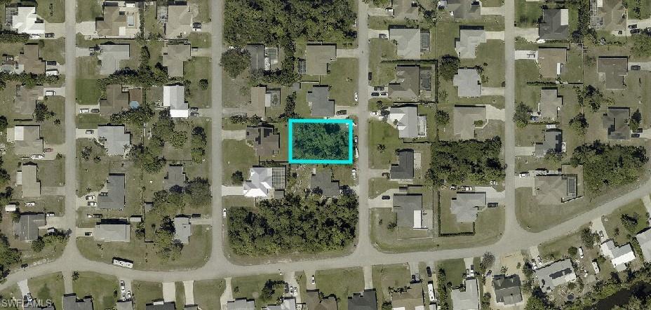 18274 Fuchsia Road Fort Myers, FL 33967 - Photo 2 of 7 Aerial view of residential area with property parcel outlined