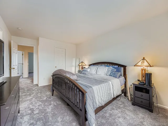 a bedroom with a bed and a view of bedroom