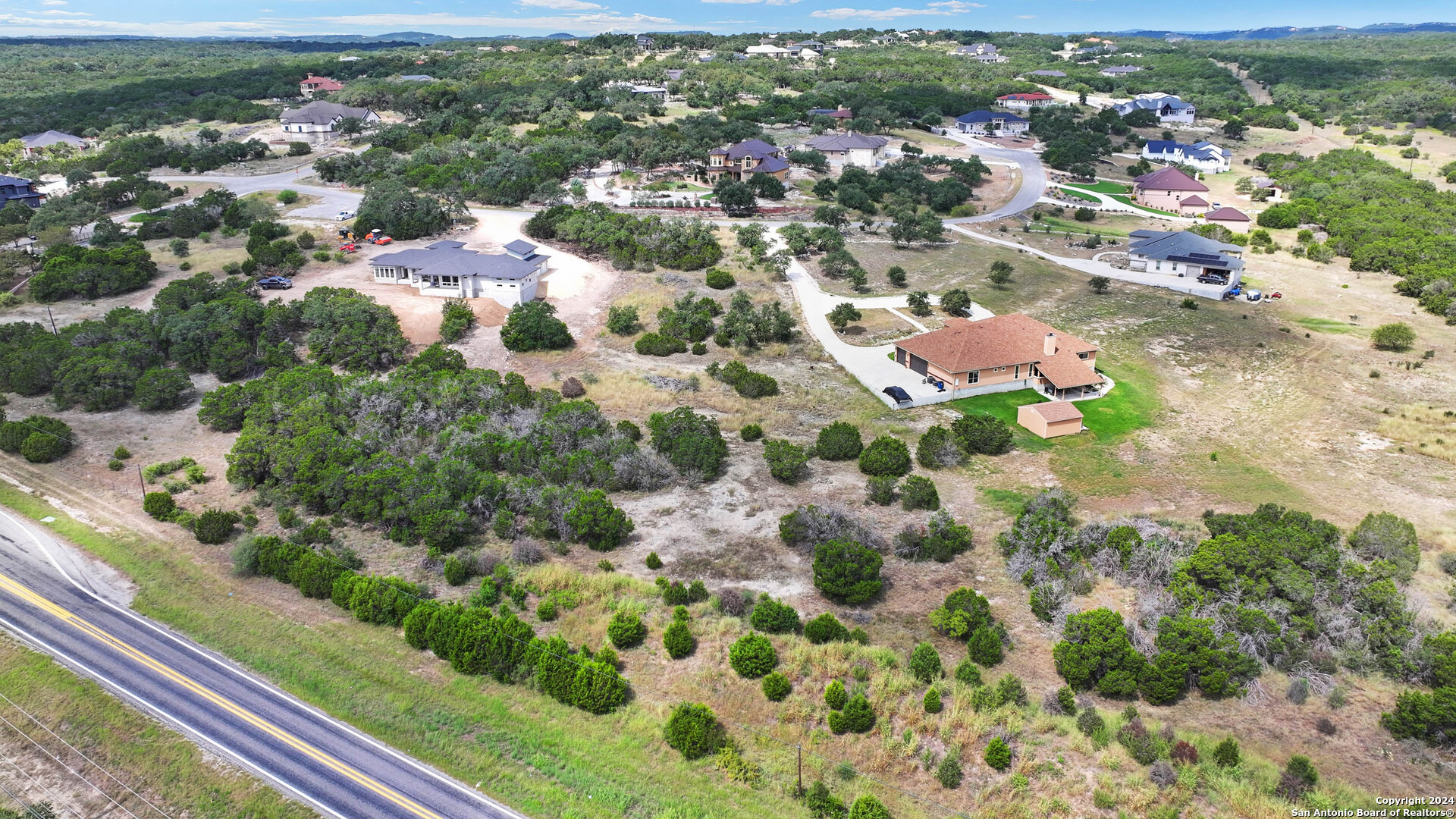 27010 Rocky Rim San Antonio, TX 78266 - Photo 12 of 13 an aerial view of residential houses with outdoor space and trees