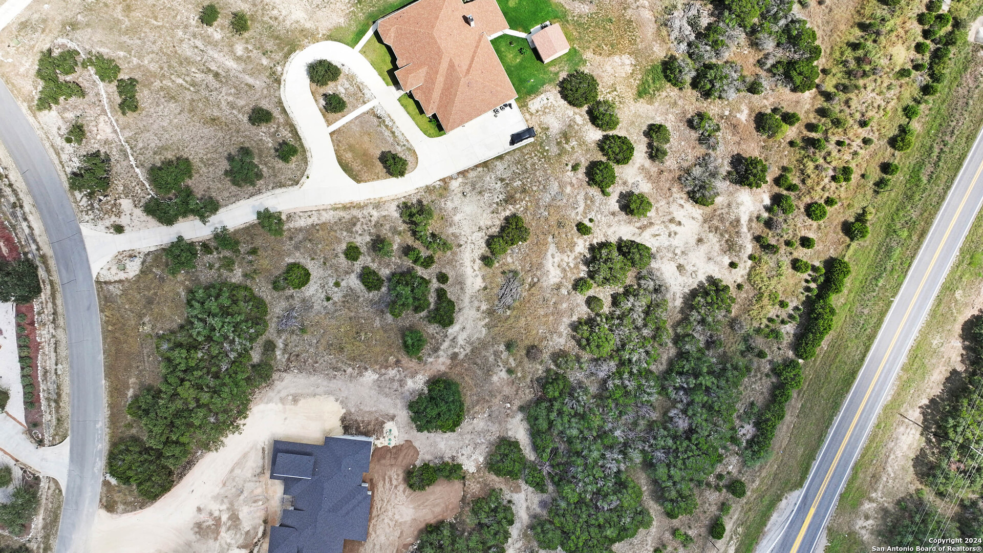 27010 Rocky Rim San Antonio, TX 78266 - Photo 2 of 13 view of a yard with plants