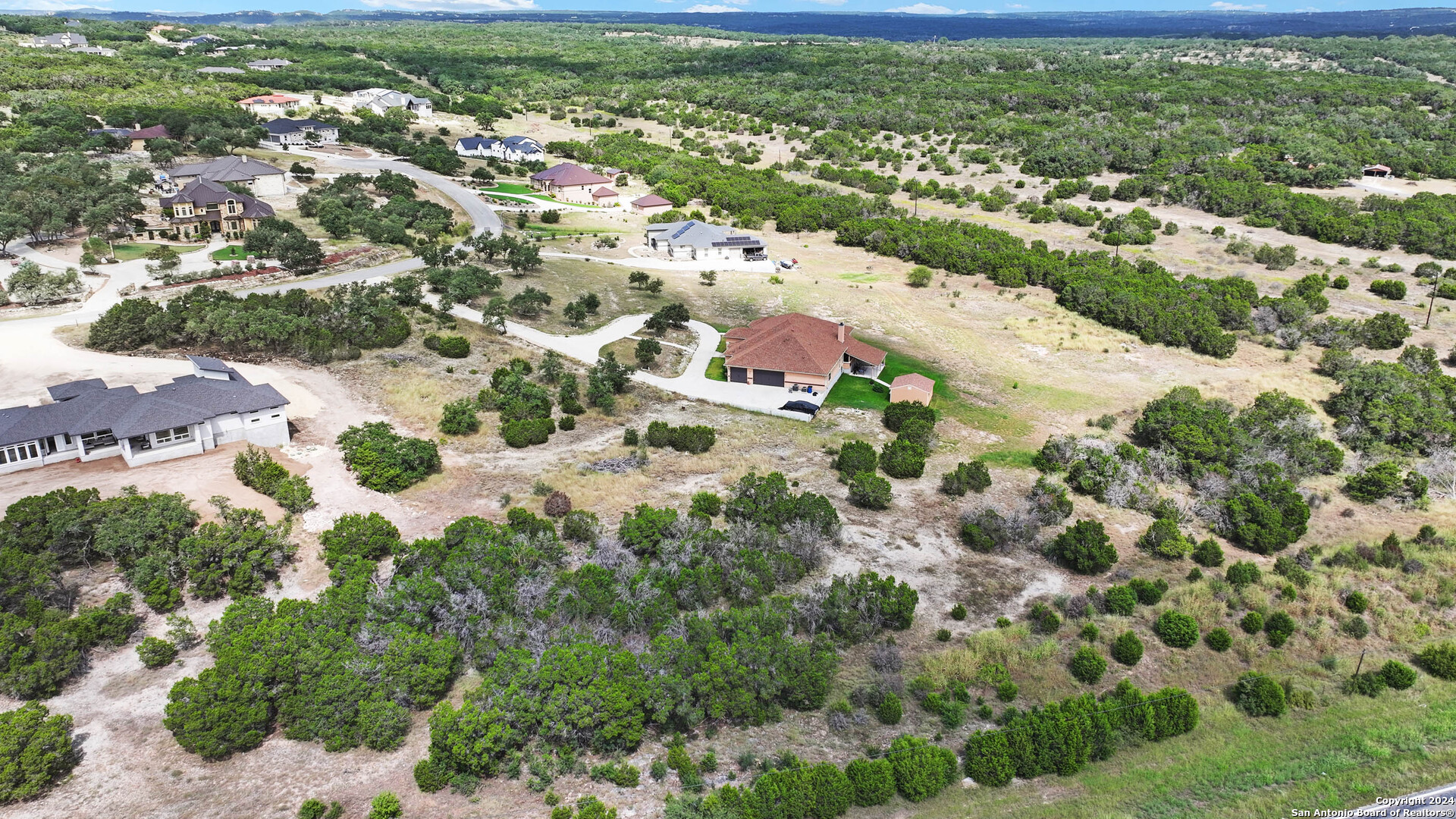 27010 Rocky Rim San Antonio, TX 78266 - Photo 4 of 13 an aerial view of residential houses with outdoor space