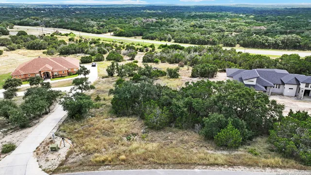 an aerial view of house with yard