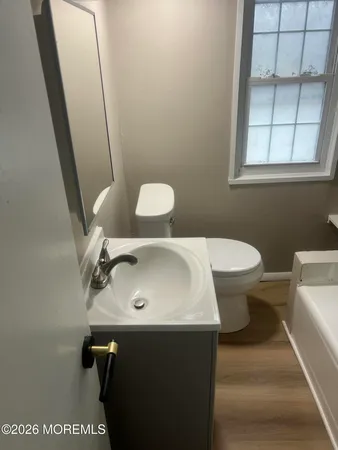 a bathroom with a sink and toilet