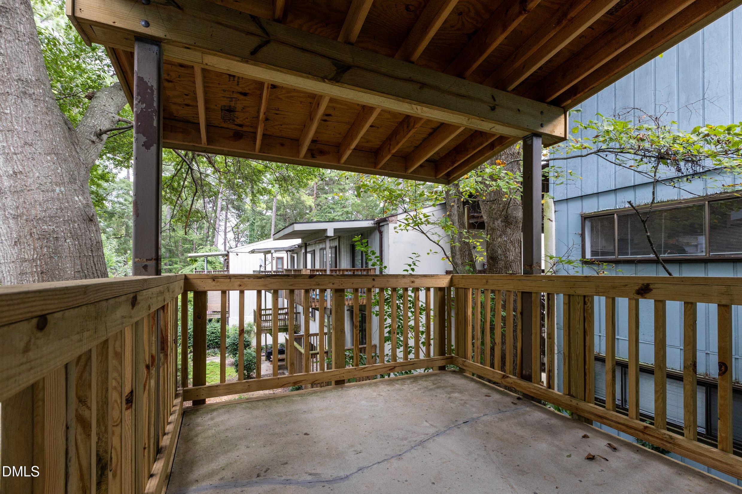5036 Flint Ridge Place Raleigh, NC 27609 - Photo 21 of 21 a view of a porch with wooden floor