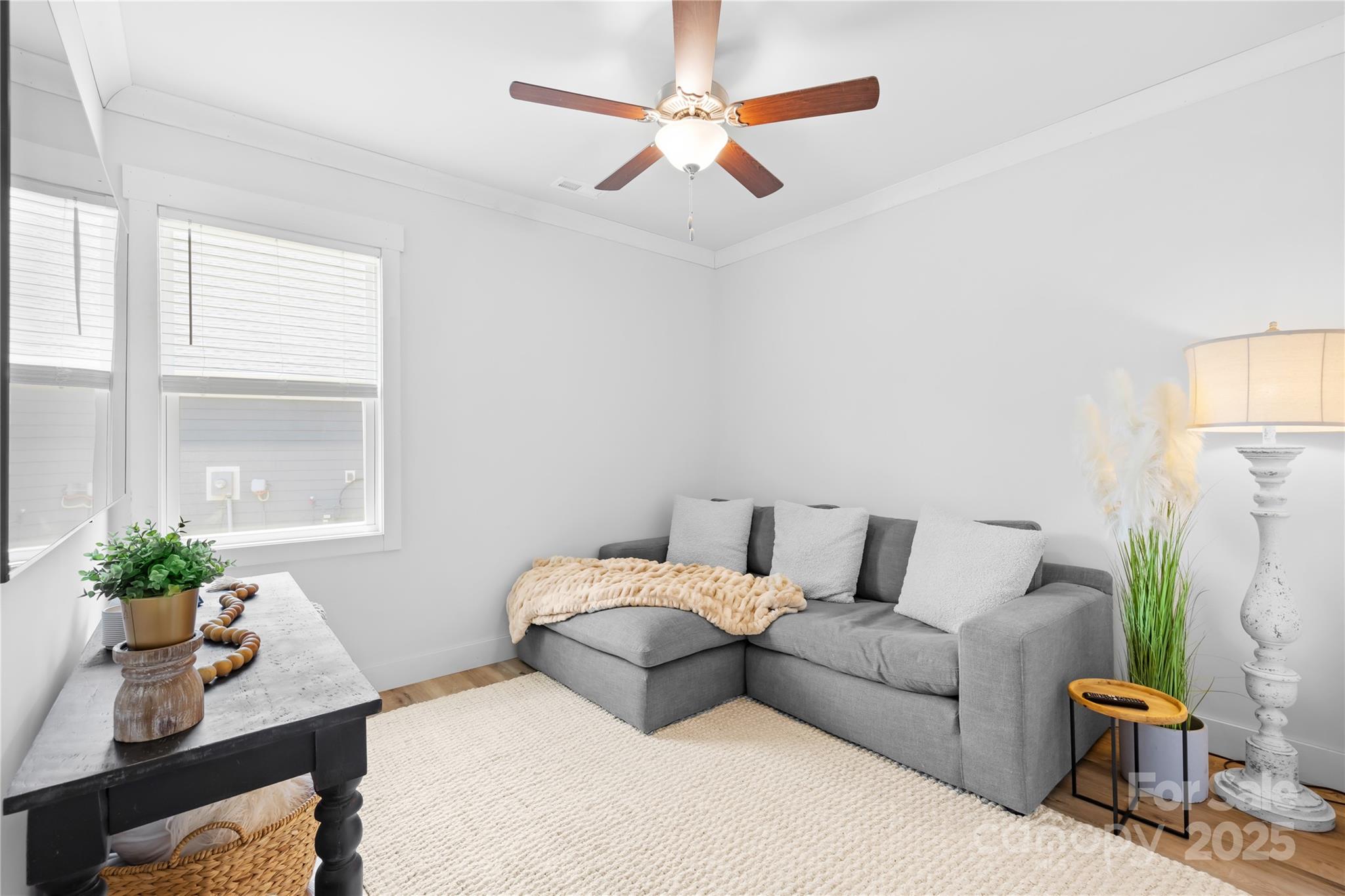 3610 Whitney Way, Unit 2 Terrell, NC 28682 - Photo 11 of 16 a bedroom with a bed a couch and a potted plant