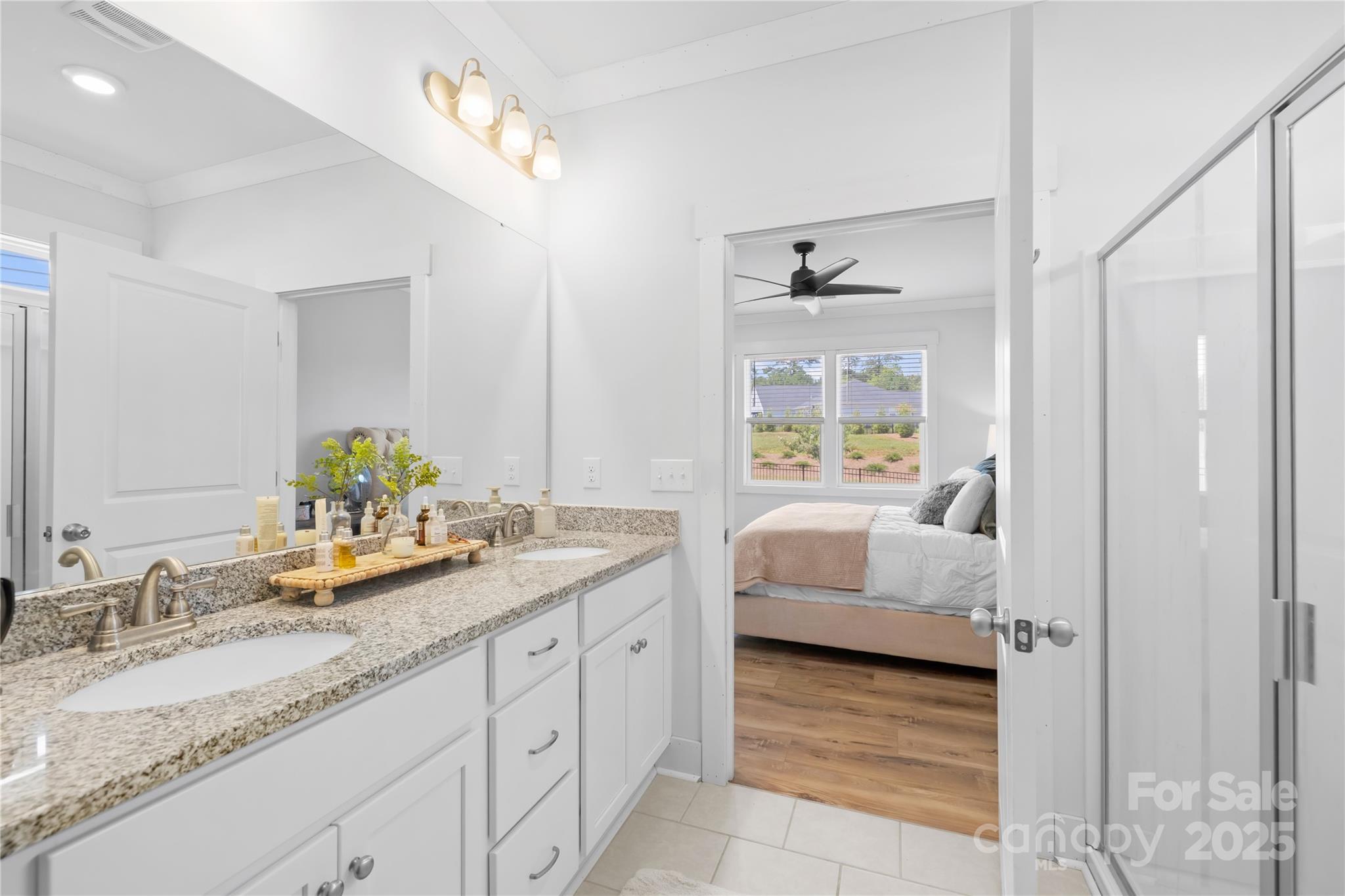 3610 Whitney Way, Unit 2 Terrell, NC 28682 - Photo 16 of 16 a spacious bathroom with a granite countertop sink and a mirror