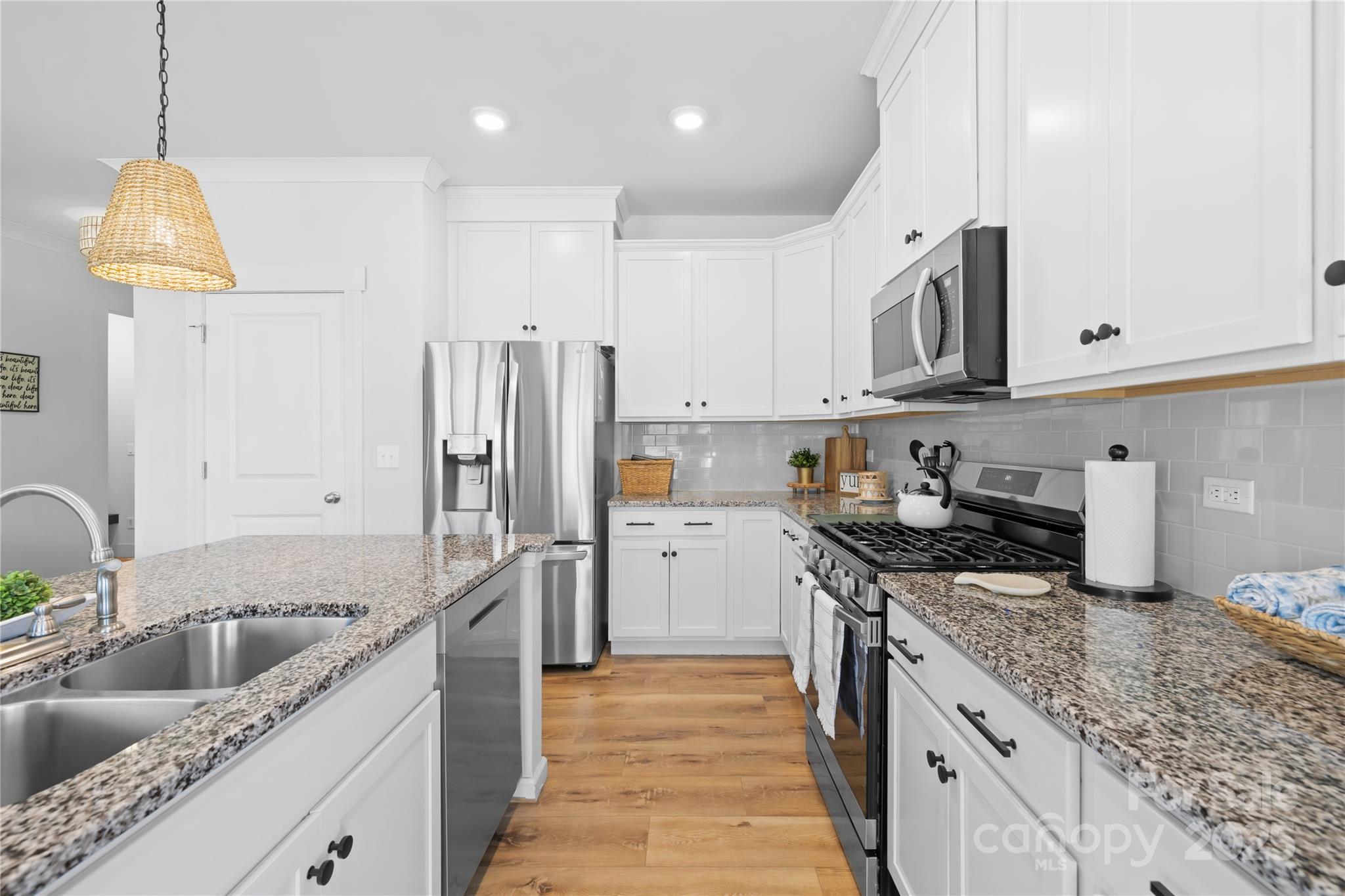 3610 Whitney Way, Unit 2 Terrell, NC 28682 - Photo 9 of 16 a kitchen with stainless steel appliances granite countertop a sink stove and refrigerator
