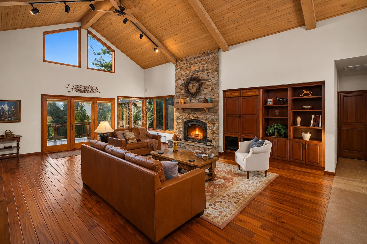 238 Clouds Rest Portola, CA 96122 - Photo 5 of 34 a living room with fireplace furniture and a wooden floor