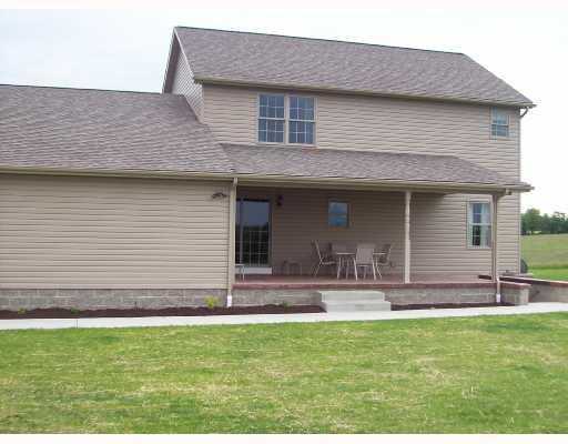 240 Zitney Road Vanderbilt, PA 15486 - Photo 2 of 8 Exterior Back. Rear covered patio, stamped & dyed concrete floor, access to basement