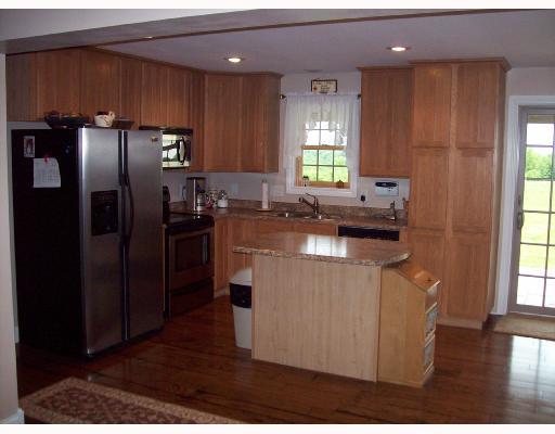 240 Zitney Road Vanderbilt, PA 15486 - Photo 4 of 8 Kitchen. Center island, stainless steel appliances, bruce antique distress hardwood floor.