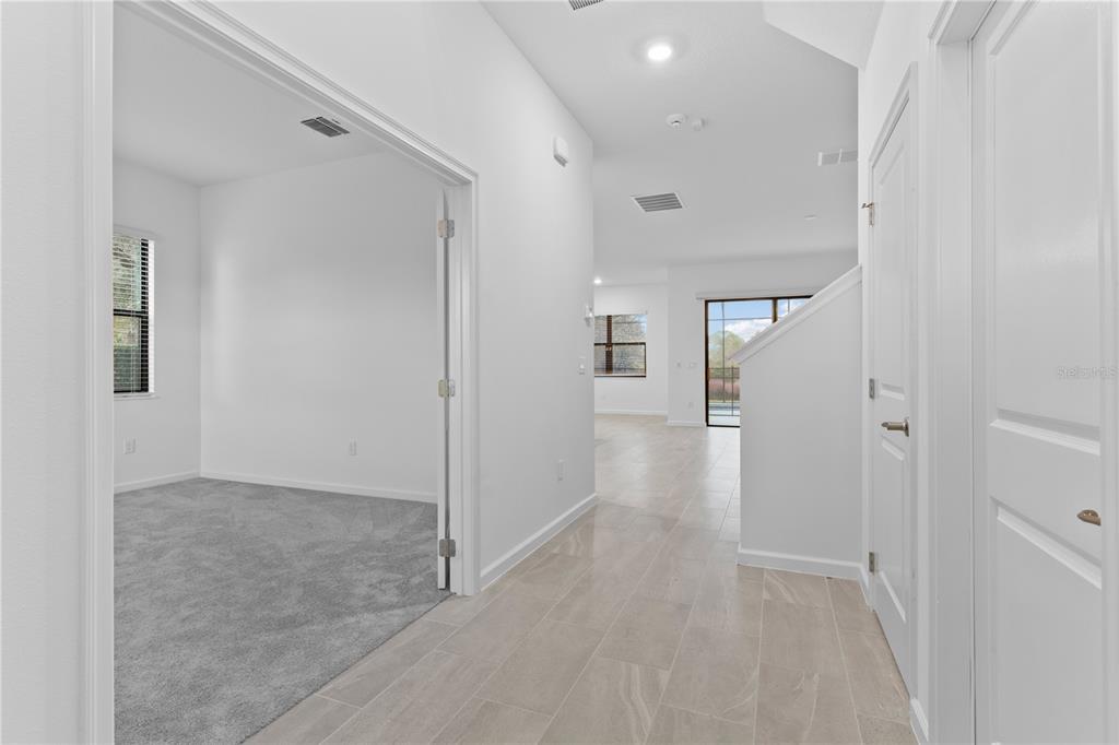 1205 Butterfly Orchid Road Davenport, FL 33837 - Photo 16 of 69 a view of a hallway