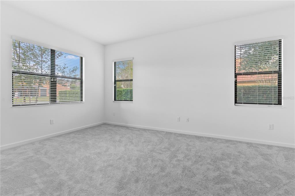 1205 Butterfly Orchid Road Davenport, FL 33837 - Photo 19 of 69 an empty room with windows