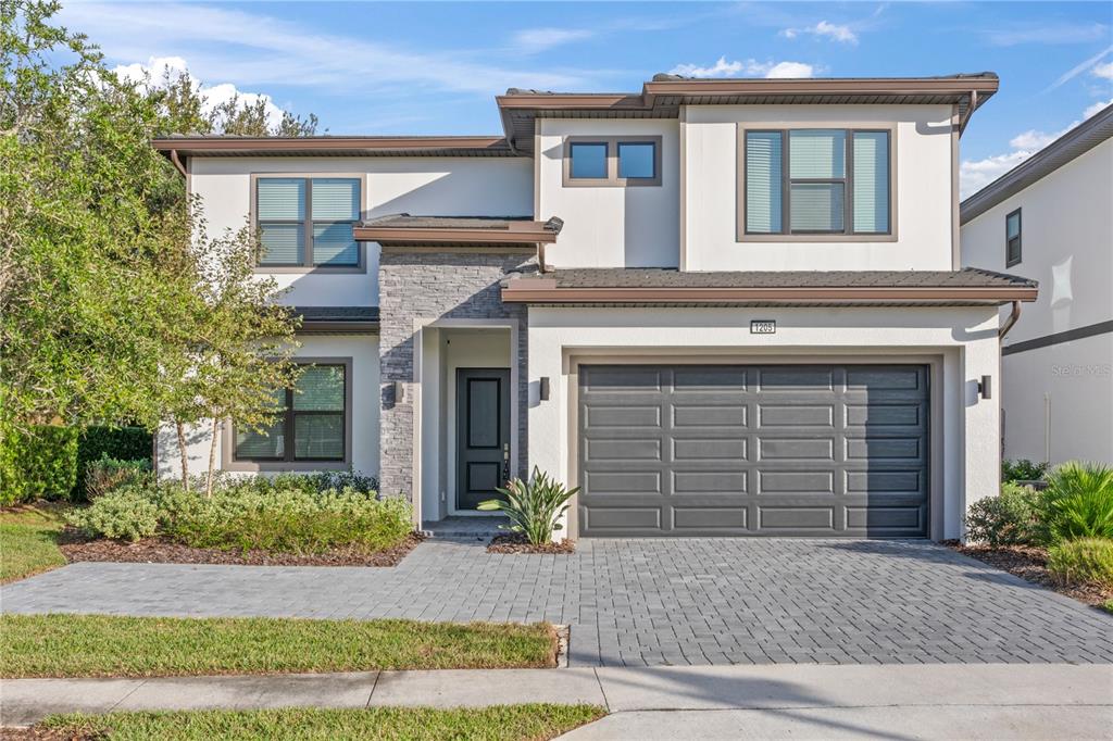 1205 Butterfly Orchid Road Davenport, FL 33837 - Photo 2 of 69 front view of a house