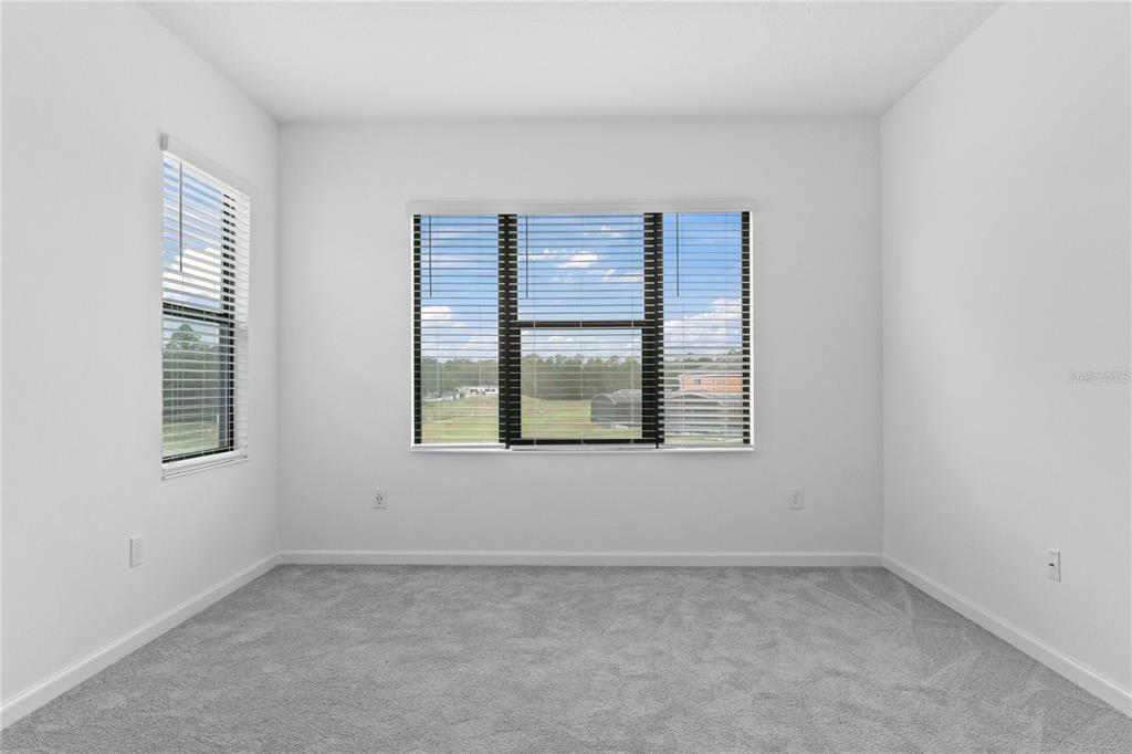 1205 Butterfly Orchid Road Davenport, FL 33837 - Photo 27 of 69 an empty room with a window