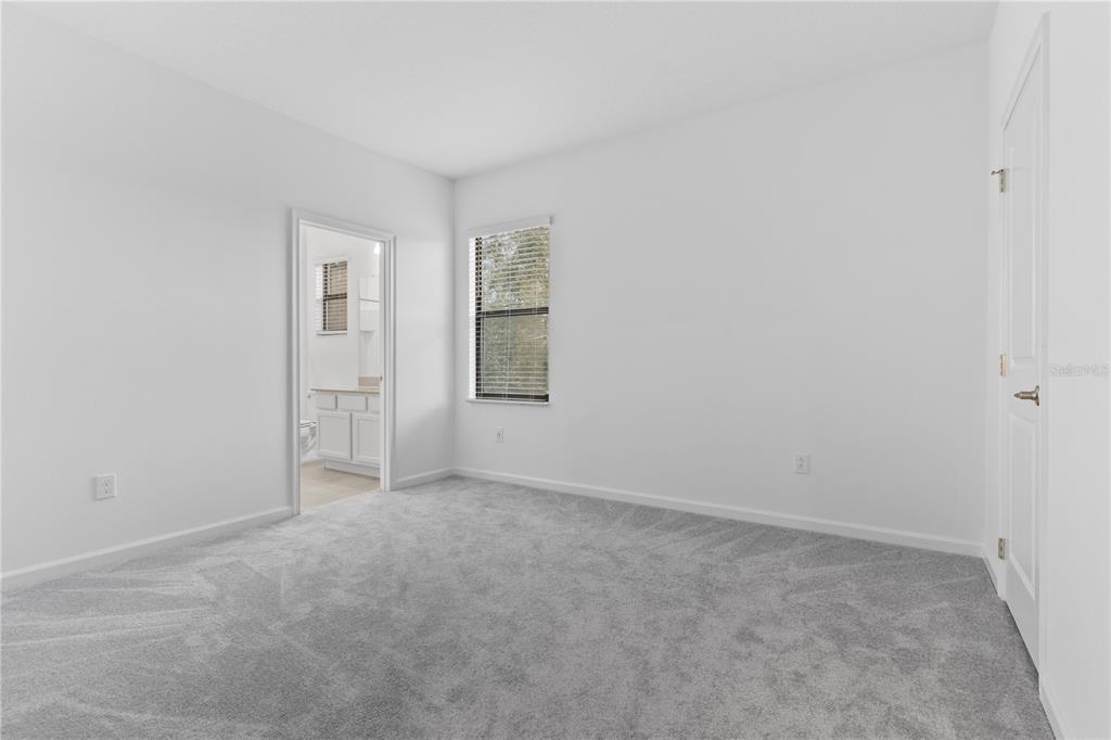 1205 Butterfly Orchid Road Davenport, FL 33837 - Photo 38 of 69 an empty room with windows