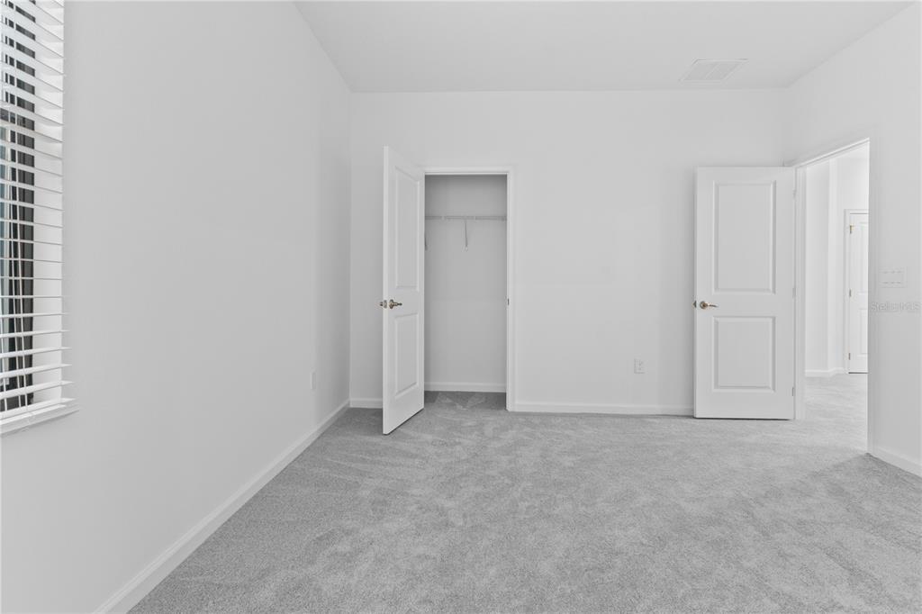 1205 Butterfly Orchid Road Davenport, FL 33837 - Photo 41 of 69 a view of an empty room