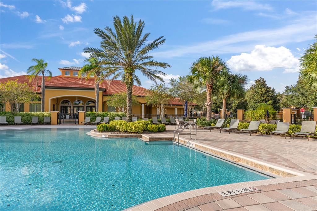 1205 Butterfly Orchid Road Davenport, FL 33837 - Photo 56 of 69 a view of a house with swimming pool and sitting area