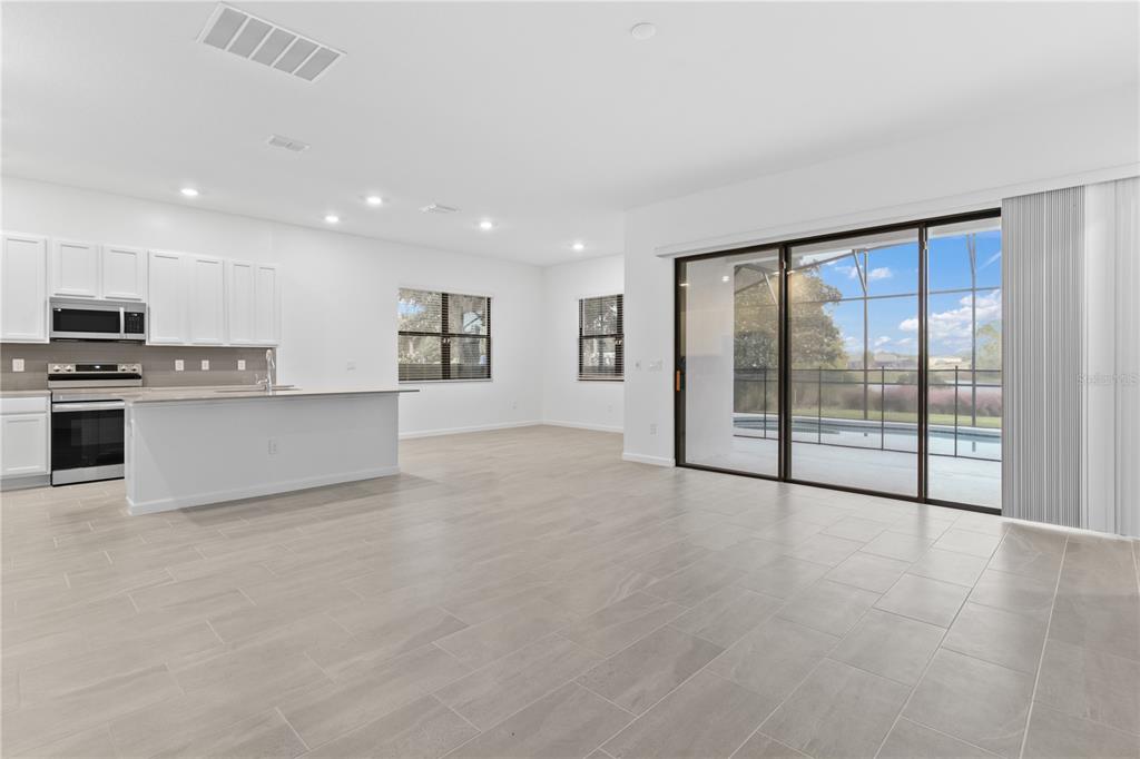 1205 Butterfly Orchid Road Davenport, FL 33837 - Photo 6 of 69 a view of an empty room with a window