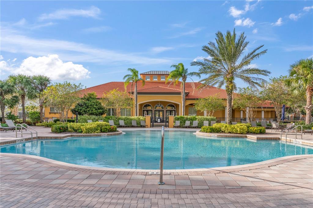 1205 Butterfly Orchid Road Davenport, FL 33837 - Photo 62 of 69 a view of a swimming pool and a yard
