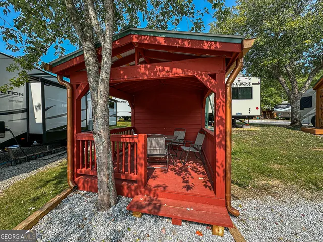 a view of a house with a large tree