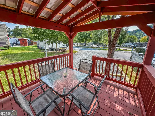 a view of a patio with wooden floor