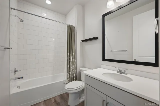 an empty room with windows and entrance