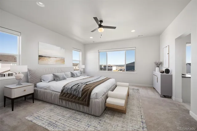 a bedroom with a bed and a couch