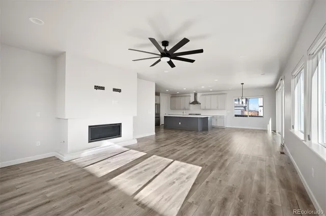 a view of kitchen with wooden floor and a window