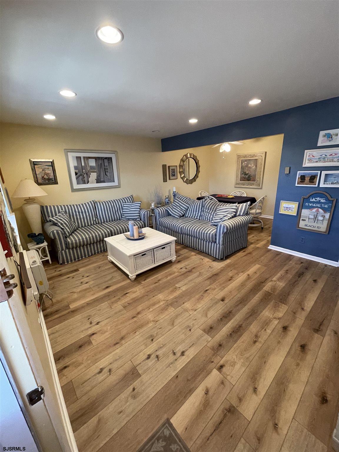 a spacious bedroom with a bed and a couch