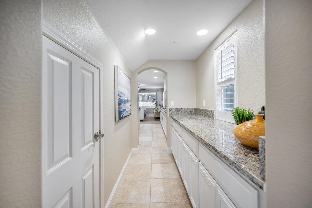 5813 Cajon Way Gilroy, CA 95020 - Photo 11 of 55 a large space with kitchen island granite countertop lots of counter space and windows