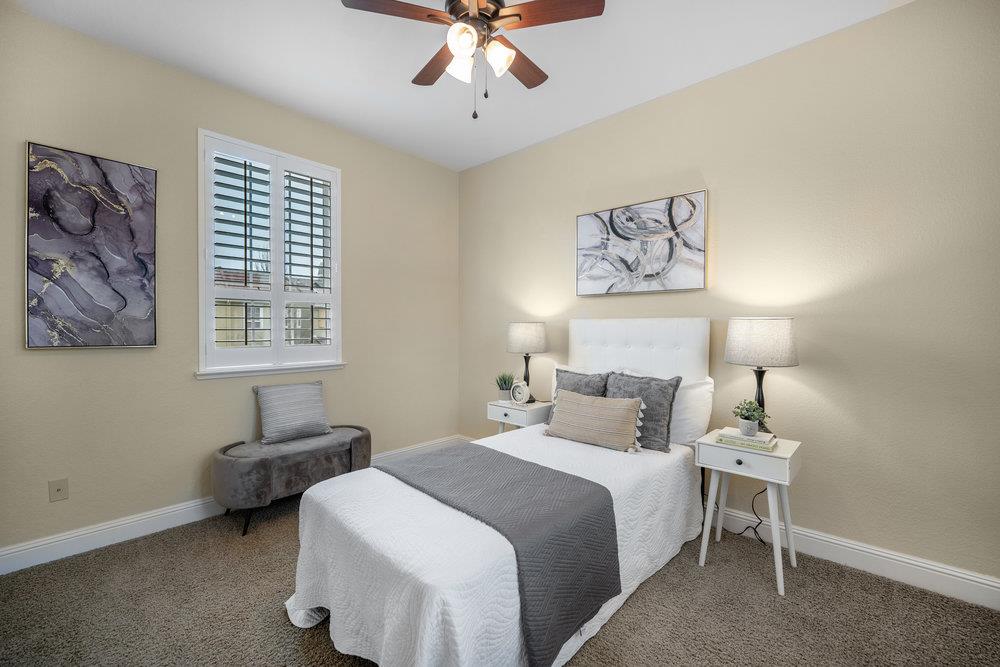 5813 Cajon Way Gilroy, CA 95020 - Photo 15 of 55 a bedroom with a bed and a lamp