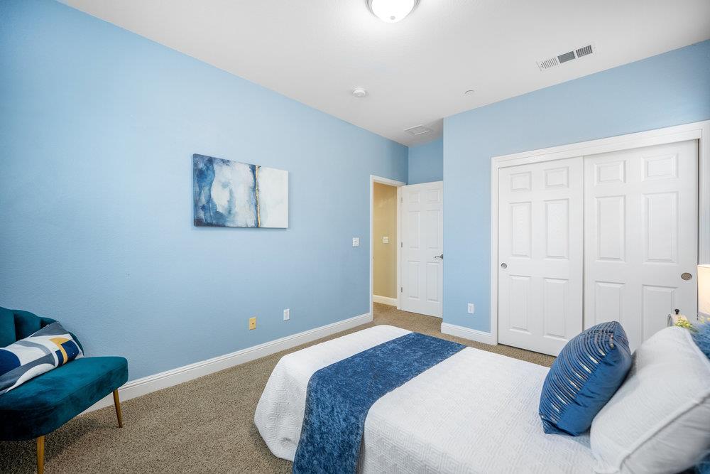 5813 Cajon Way Gilroy, CA 95020 - Photo 21 of 55 a bedroom with a bed and a couch