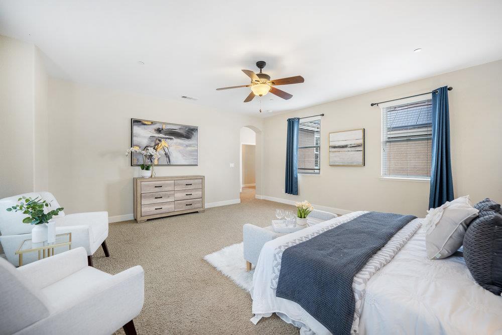 5813 Cajon Way Gilroy, CA 95020 - Photo 29 of 55 a bedroom with a bed chandelier and a window