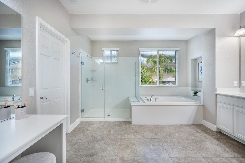 5813 Cajon Way Gilroy, CA 95020 - Photo 30 of 55 a bathroom with a tub sink and mirror